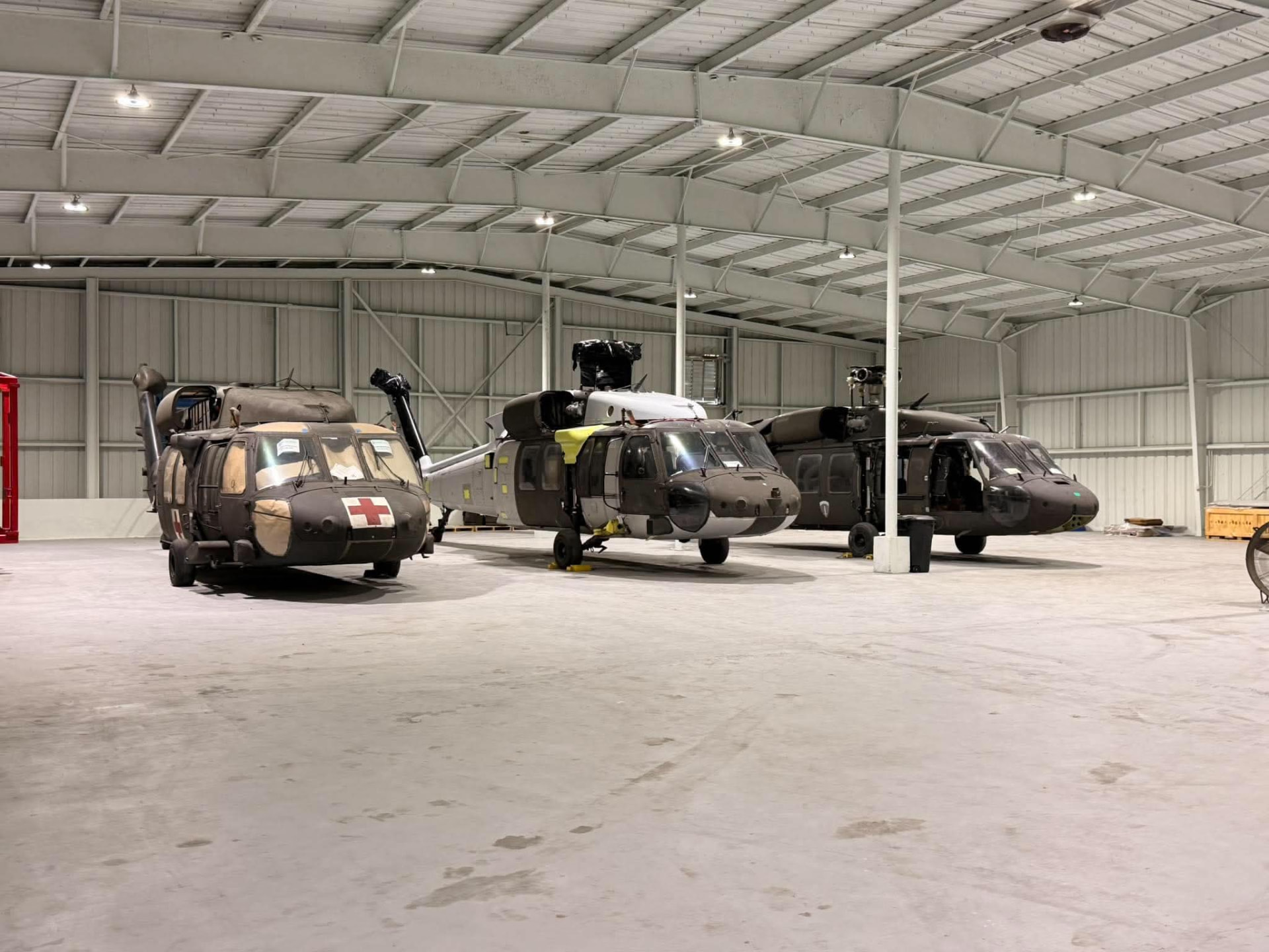 Three UH-60 Black Hawk helicopters in the Black Bird hangar